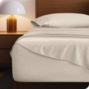 A cozy bedroom with a bed covered in soft microfiber sheets