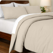 A side view of a bed made with a track stitch comforter set