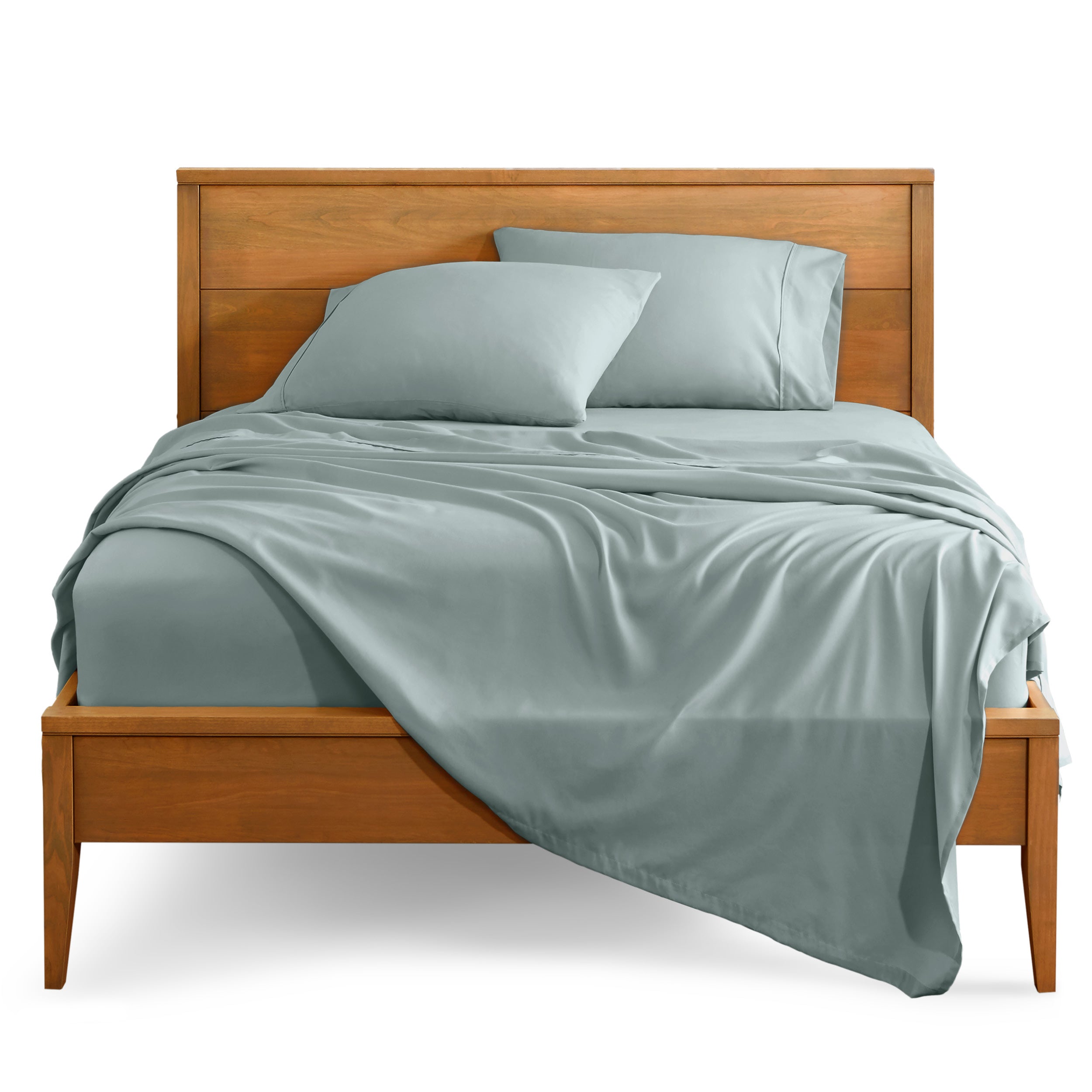 Microfiber sheet set on a bed with a wooden bed frame