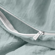 Close up of the zipper on the duvet cover partially opened