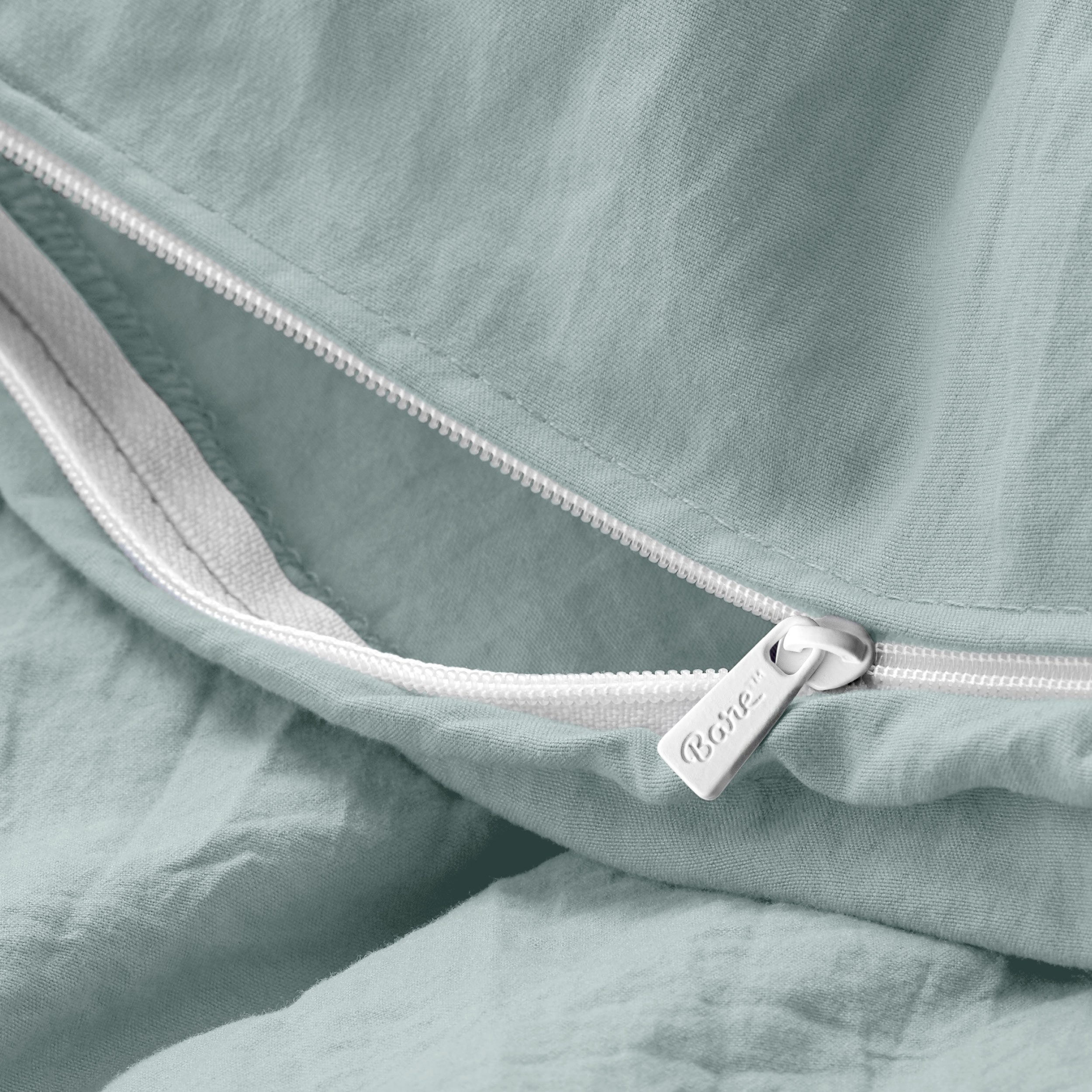 Close up of the zipper on the duvet cover partially opened