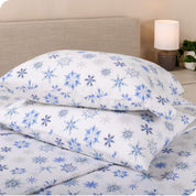 Printed flannel pillowcases and sheets on a bed