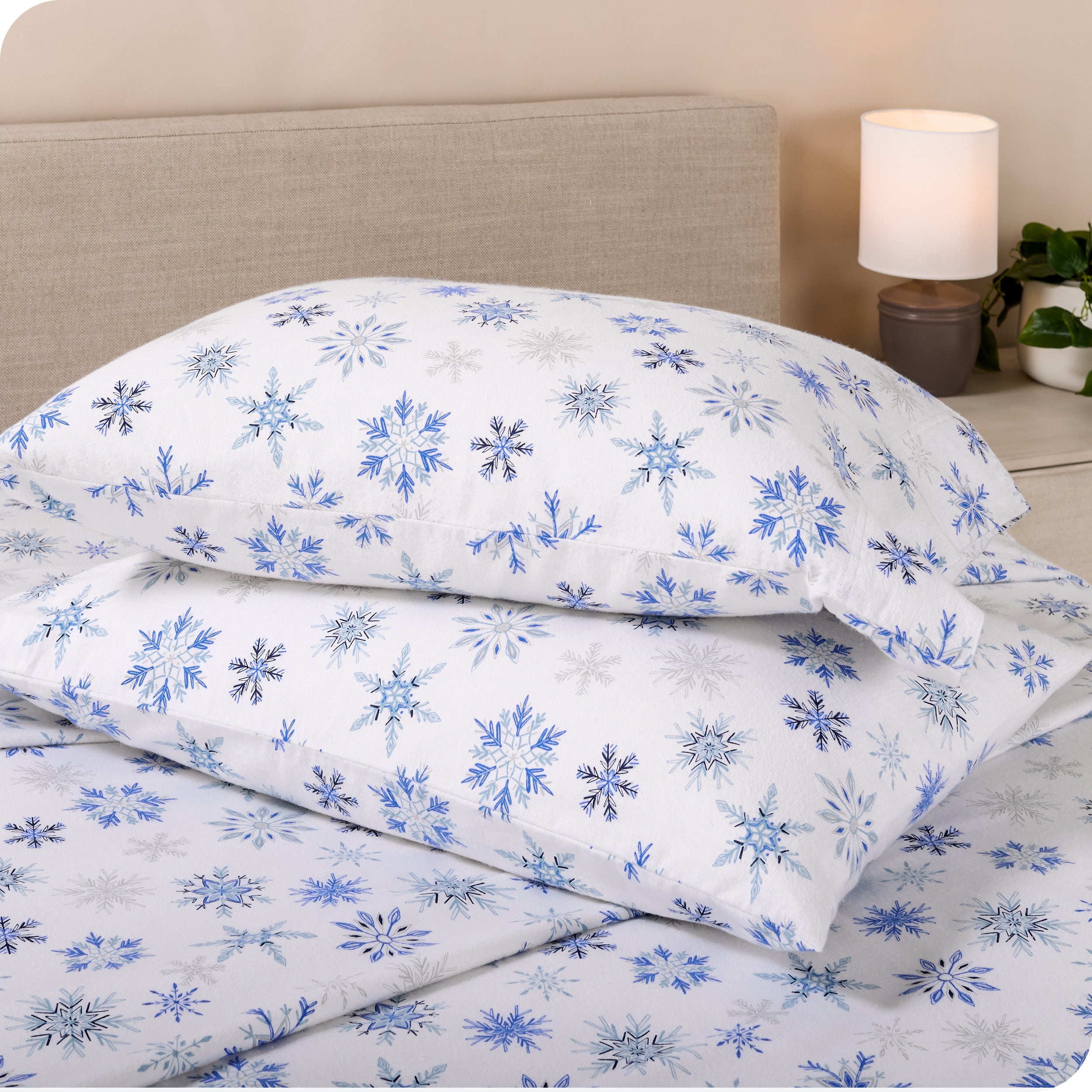 Printed flannel pillowcases and sheets on a bed