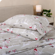 Printed flannel pillowcases and sheets on a bed