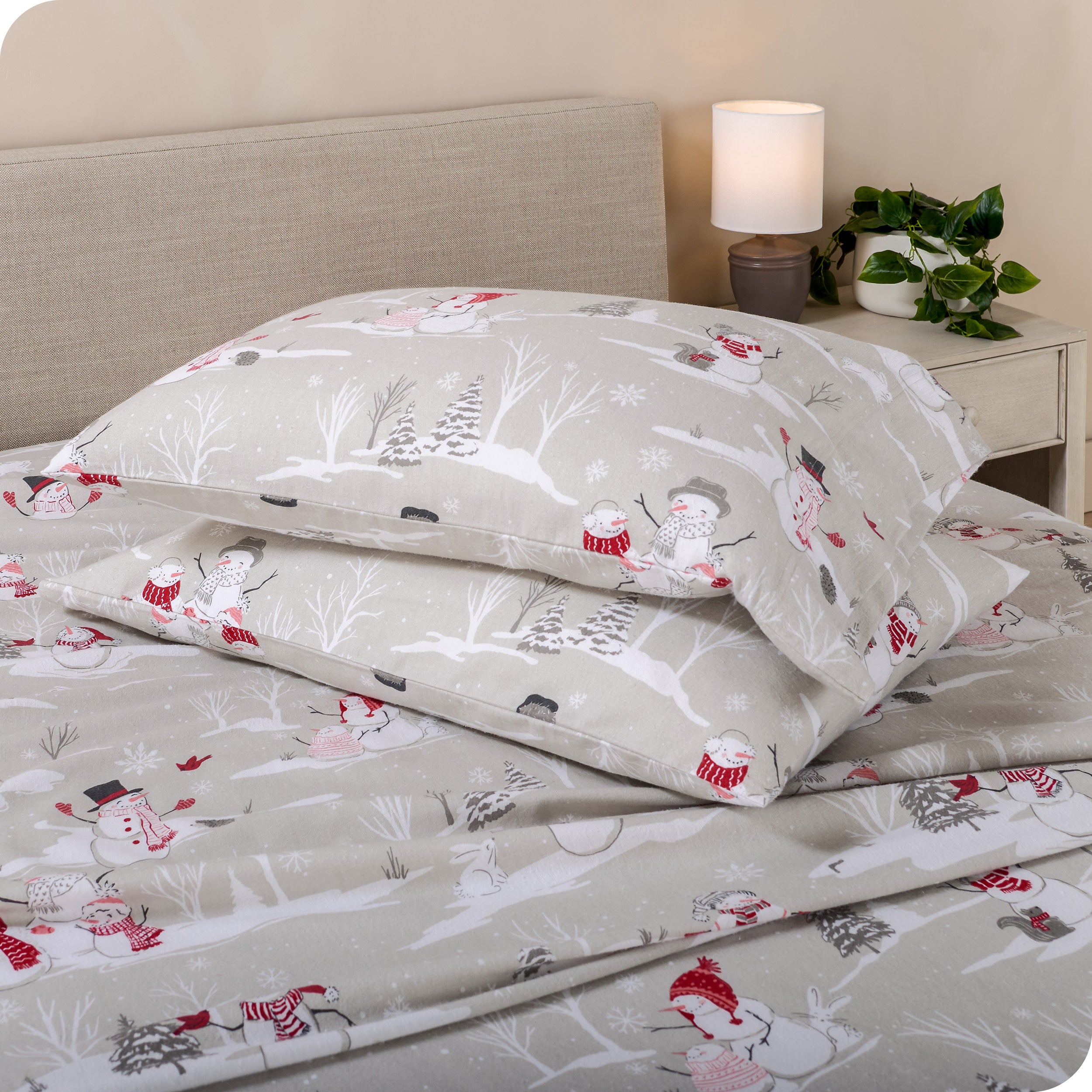 Printed flannel pillowcases and sheets on a bed