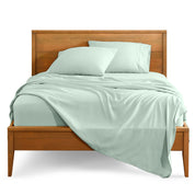 Microfiber sheet set on a bed with a wooden bed frame