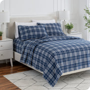 Plaid flannel sheets on a bed