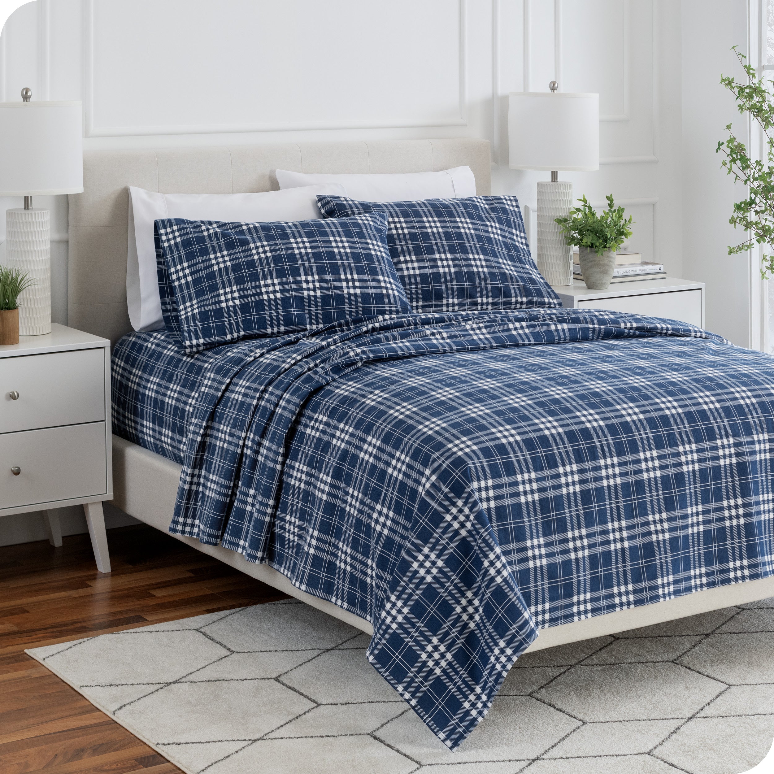 Plaid flannel sheets on a bed
