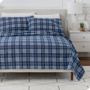 A bed made with cotton flannel sheets