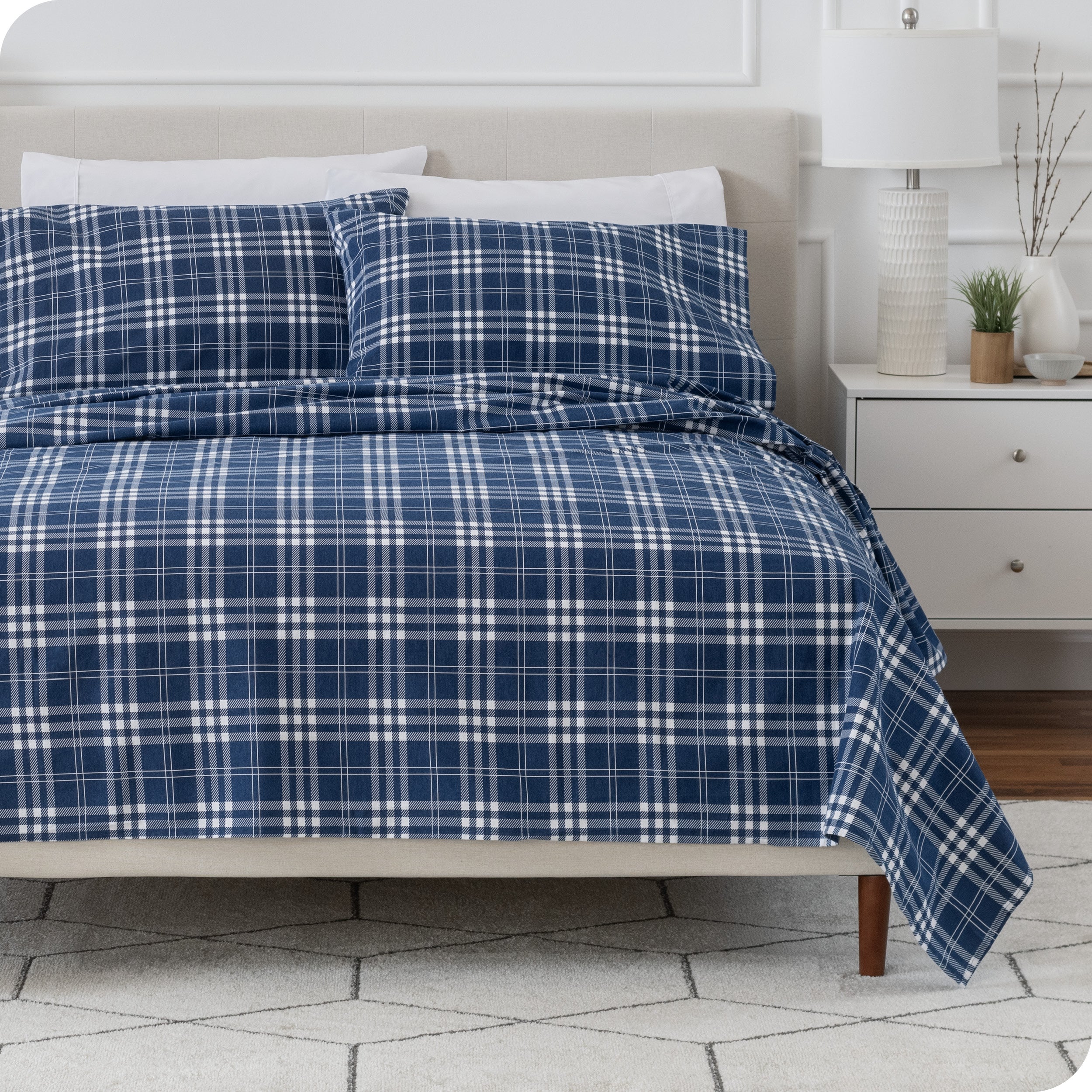 A bed made with cotton flannel sheets