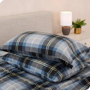 Printed flannel pillowcases and sheets on a bed