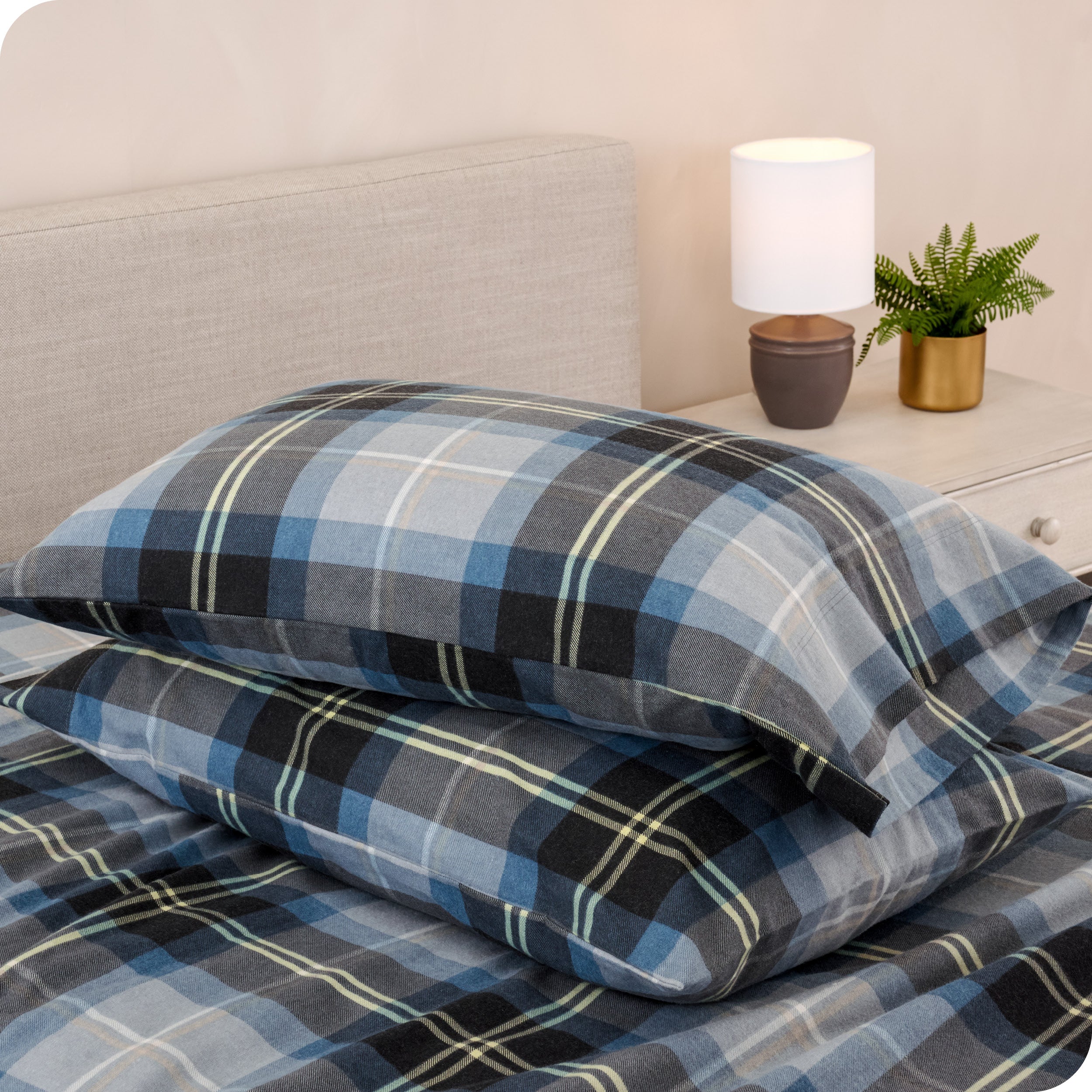 Printed flannel pillowcases and sheets on a bed
