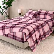 A bed made with cotton flannel sheets