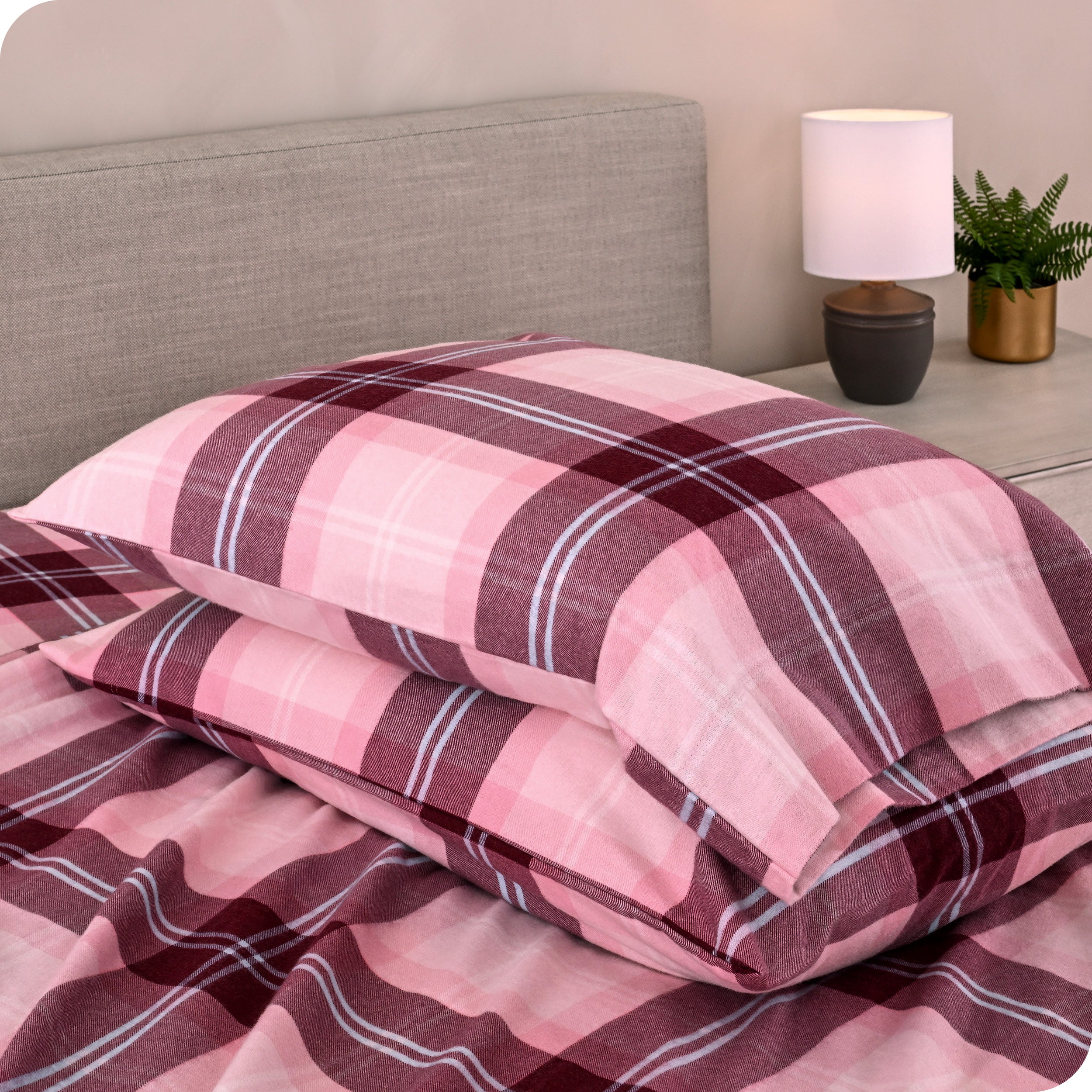 Printed flannel pillowcases and sheets on a bed