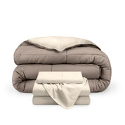 A reversible microfiber comforter and a coordinating sheet set folded and stacked