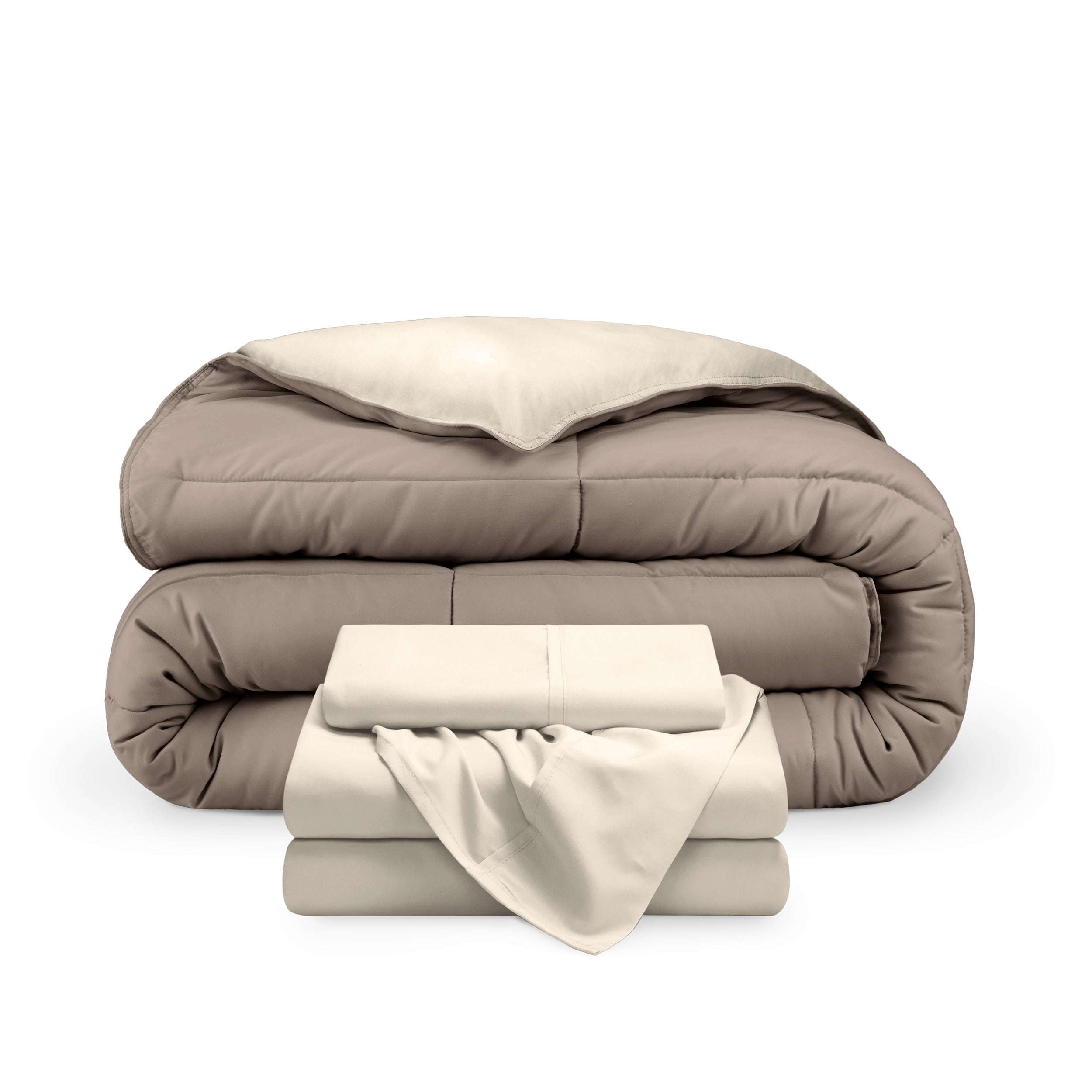 A reversible microfiber comforter and a coordinating sheet set folded and stacked