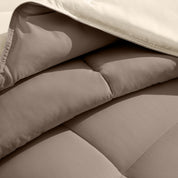 Close up of the reversible comforter showing the box stitching and the two colors