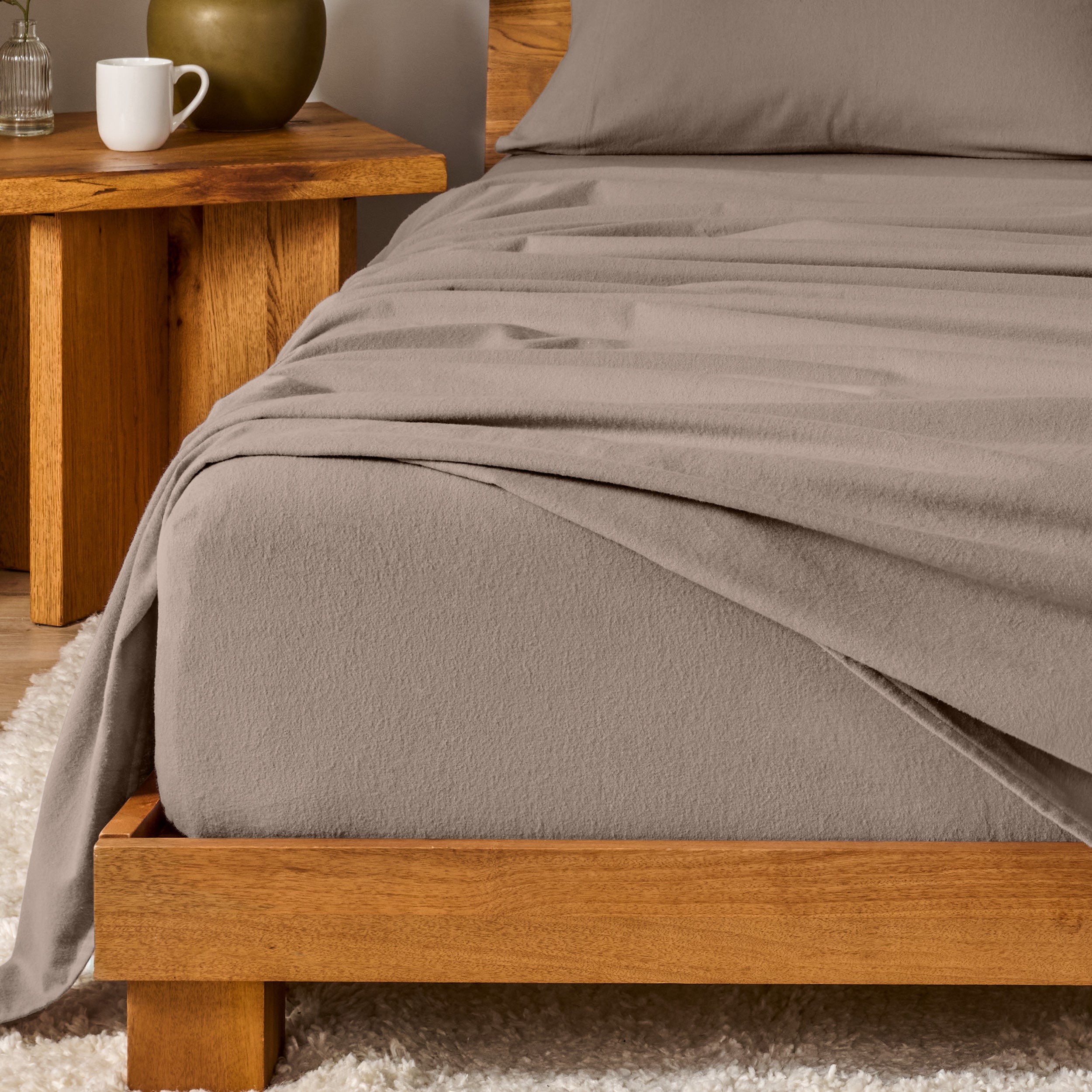A modern bedroom with cotton flannel sheets on the bed