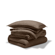 A comforter folded with a matching pillow sham stacked on top