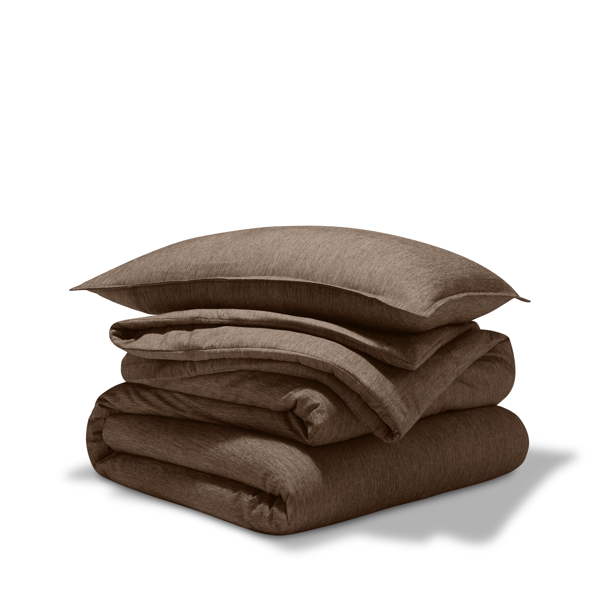 A comforter folded with a matching pillow sham stacked on top