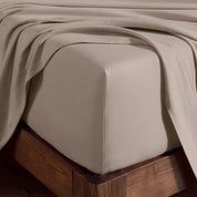 A corner of bed with fitted sheet to show the deep pocket feature and the texture.