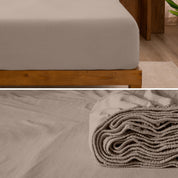 A divided image showing both the corner of a bed with organic jersey sheet and the folded sheet stacked on the bed.