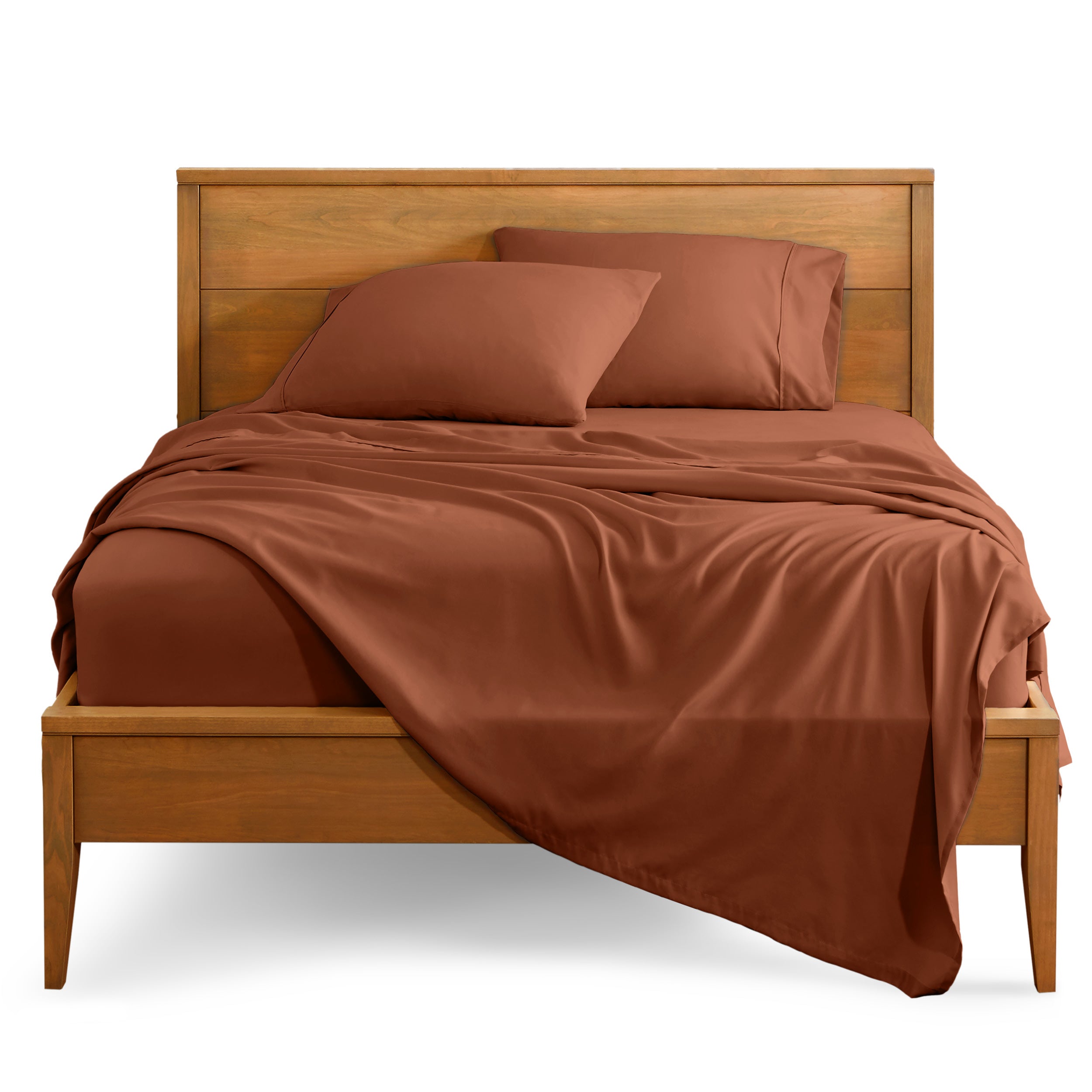 Microfiber sheet set on a bed with a wooden bed frame