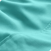 Close-up of the fabric and its neatly finished edge.
