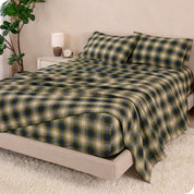 A bed made with cotton flannel sheets
