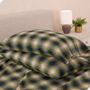 Printed flannel pillowcases and sheets on a bed