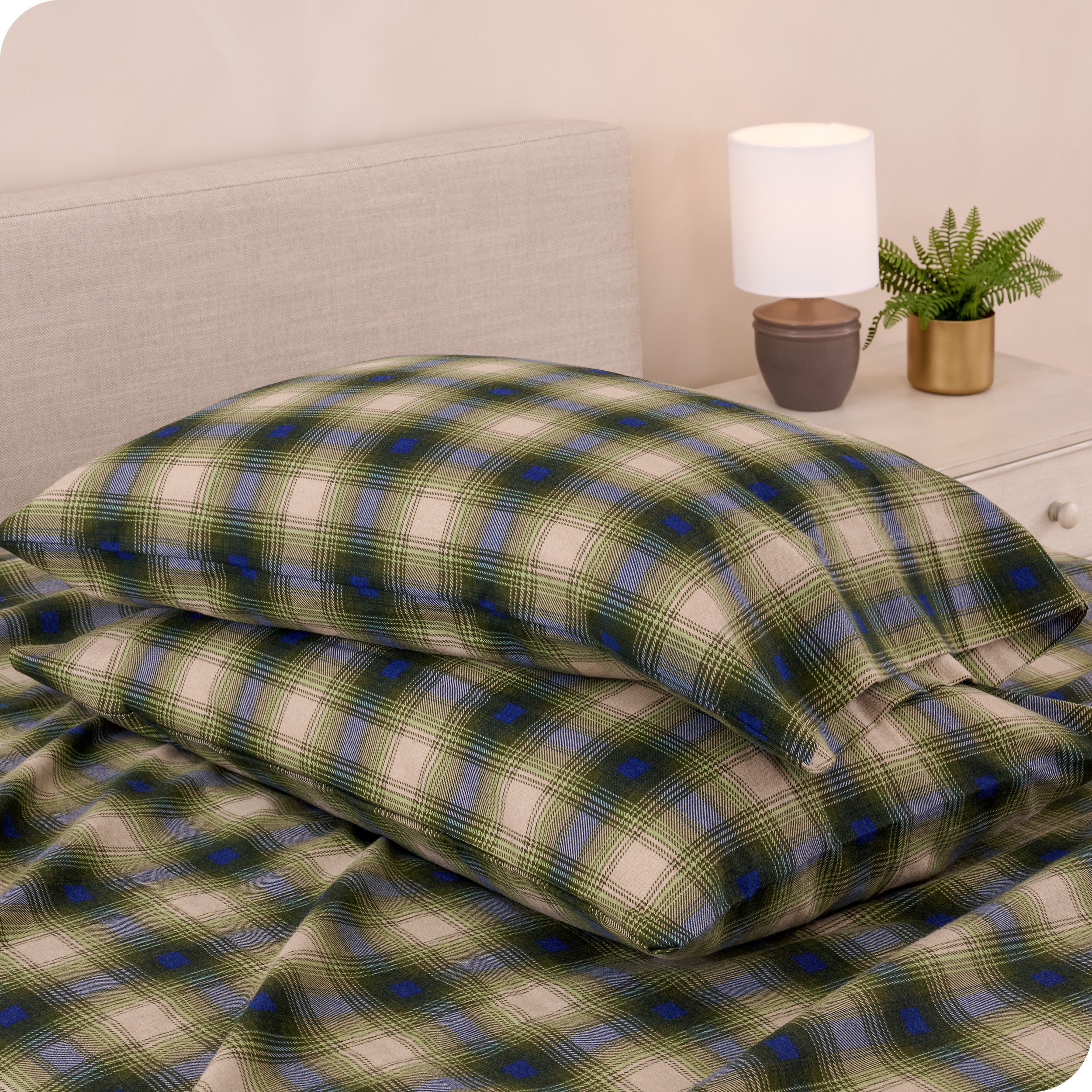 Printed flannel pillowcases and sheets on a bed