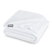 A cotton waffle blanket folded