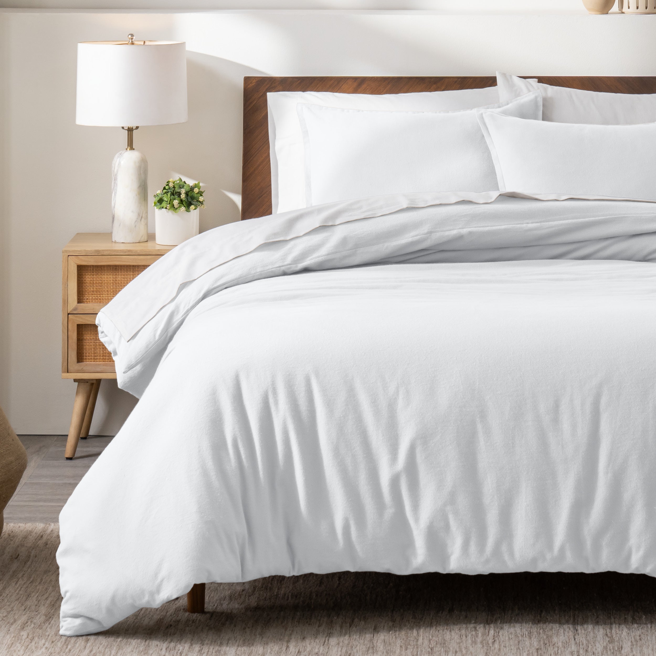 A modern bed with a flannel duvet cover set consisting of the duvet cover and two pillows.