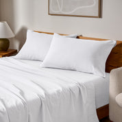 A bed made with matching flannel sheets and pillowcases