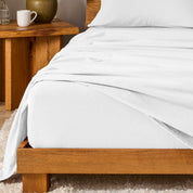 A modern bedroom with cotton flannel sheets on the bed