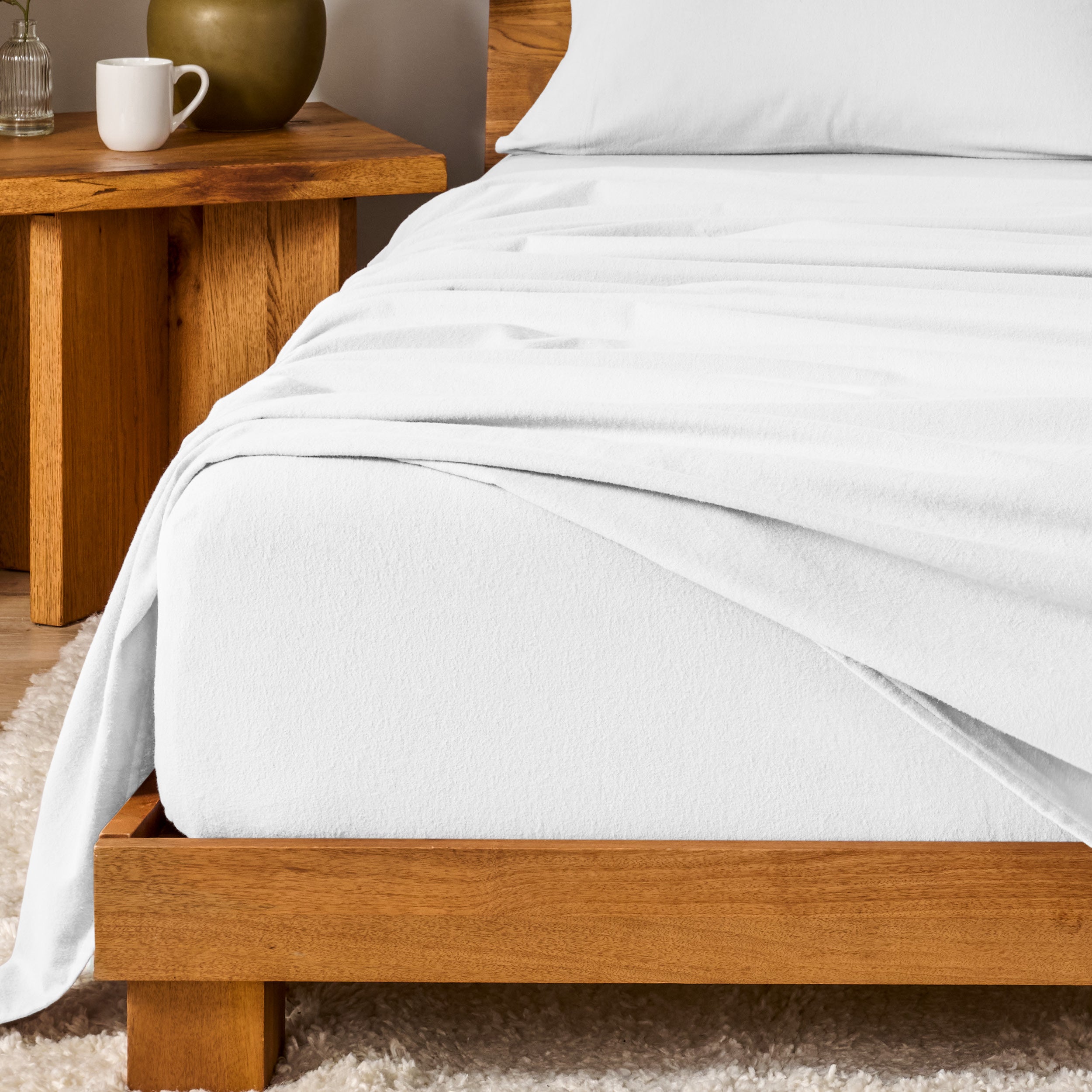 A modern bedroom with cotton flannel sheets on the bed