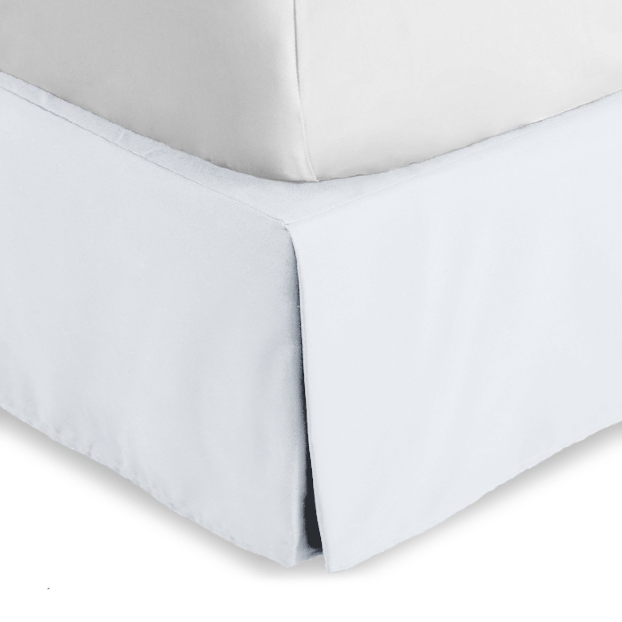 The corner of a bed skirt on a bed frame