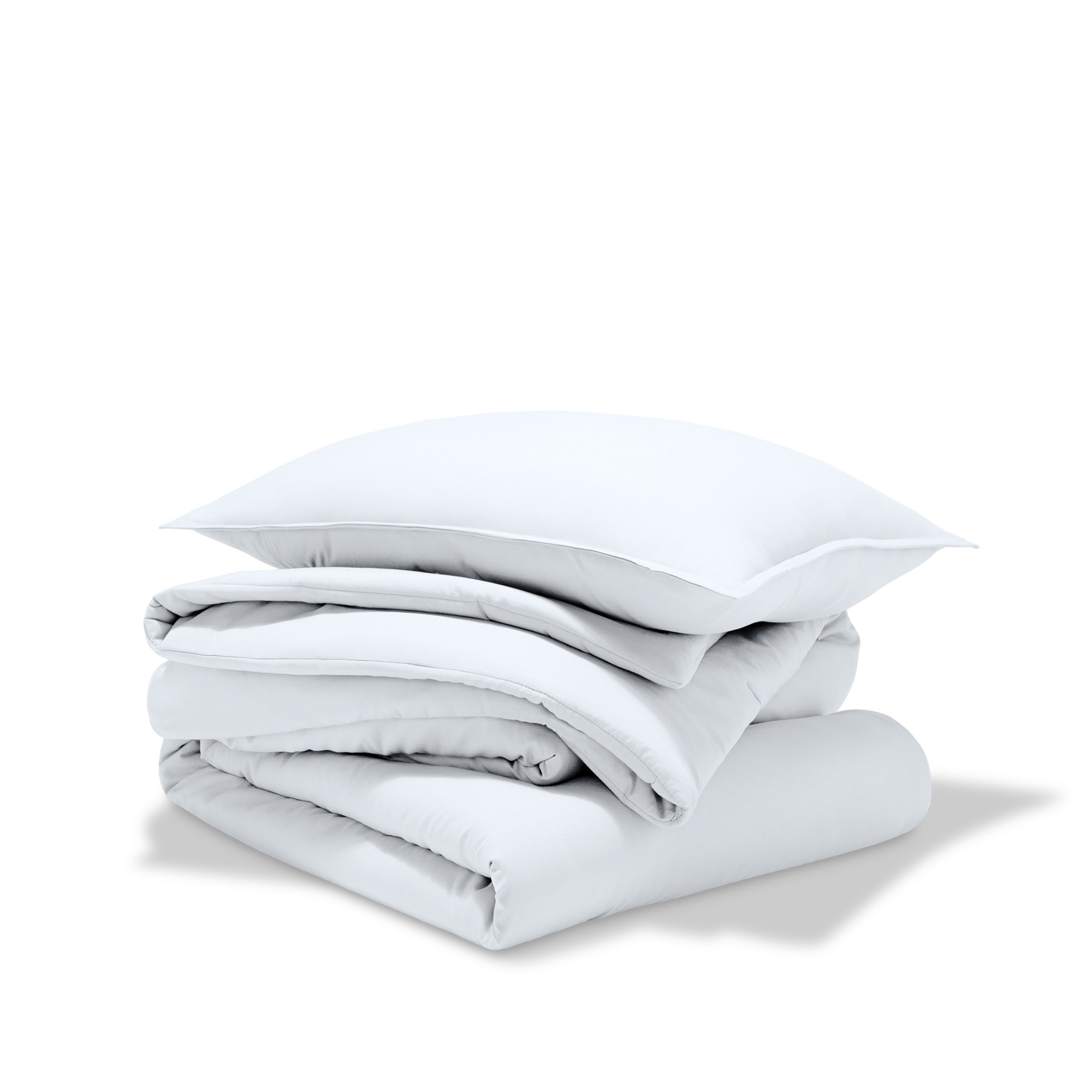 A comforter folded with a matching pillow sham stacked on top