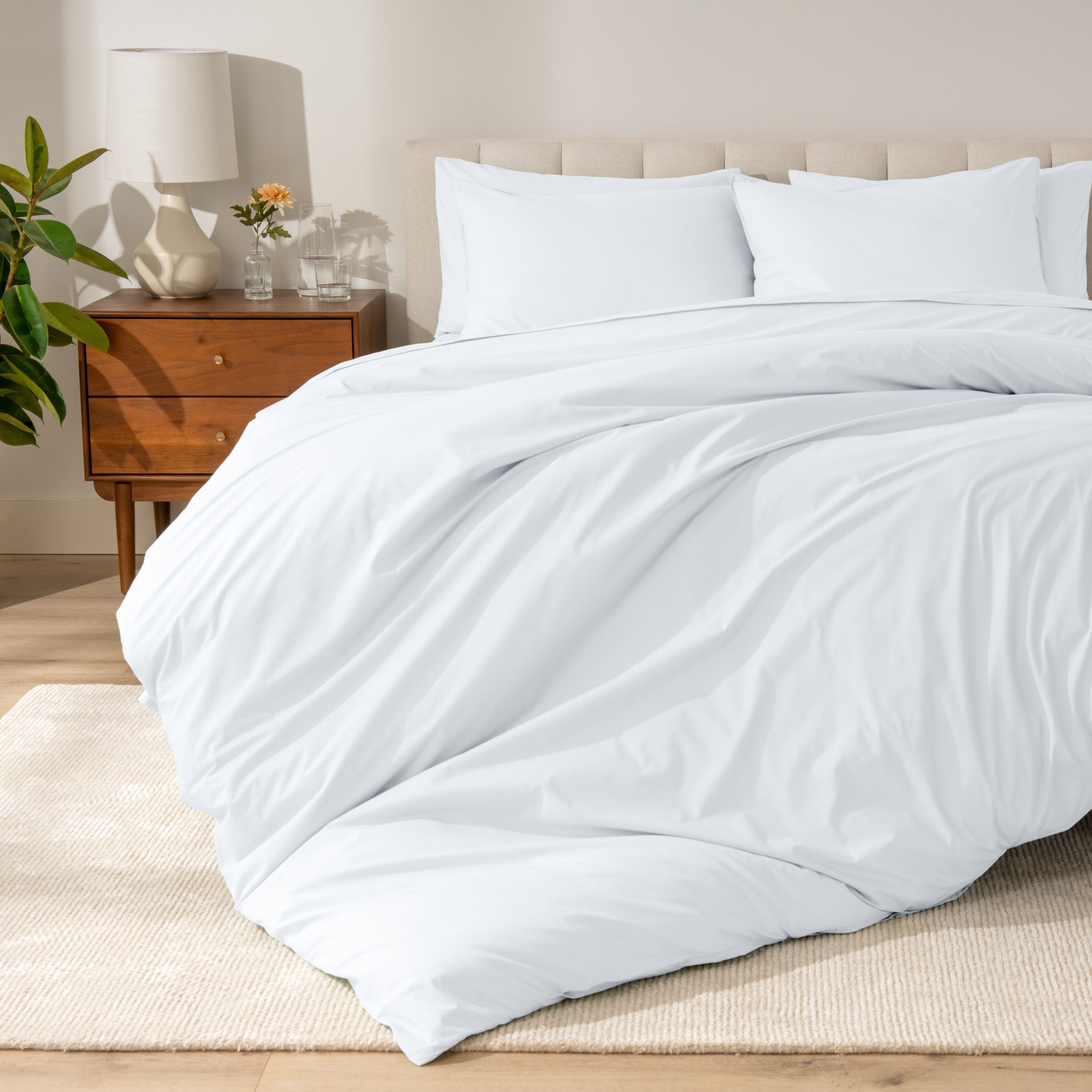 A modern bed with a organic cotton percale duvet cover on.