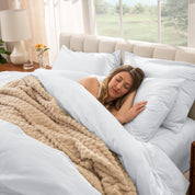 A women sleep on the bed with organic cotton percale duvet cover and pillowcases.