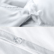 The corner ties of a duvet cover attached to a duvet insert