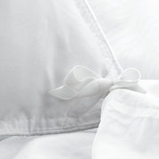 Close up of cloth ties for attaching duvet insert to inside of duvet cover