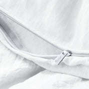 Close up of the zipper on the duvet cover partially opened