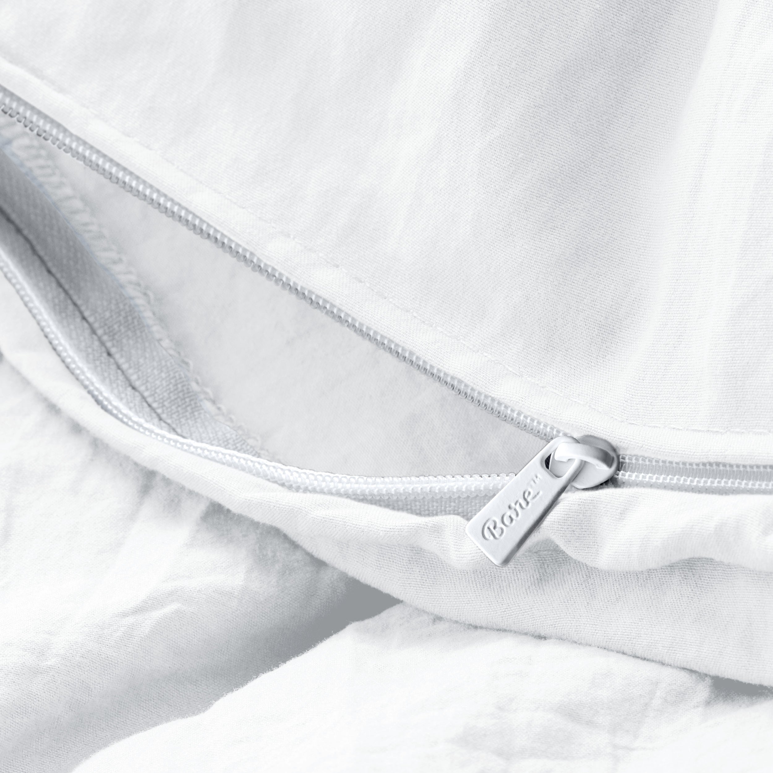 Close up of the zipper on the duvet cover partially opened