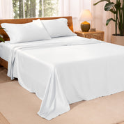 TENCEL™ sheet set on a bed. The flat sheet is draped over the side and end of the bed.