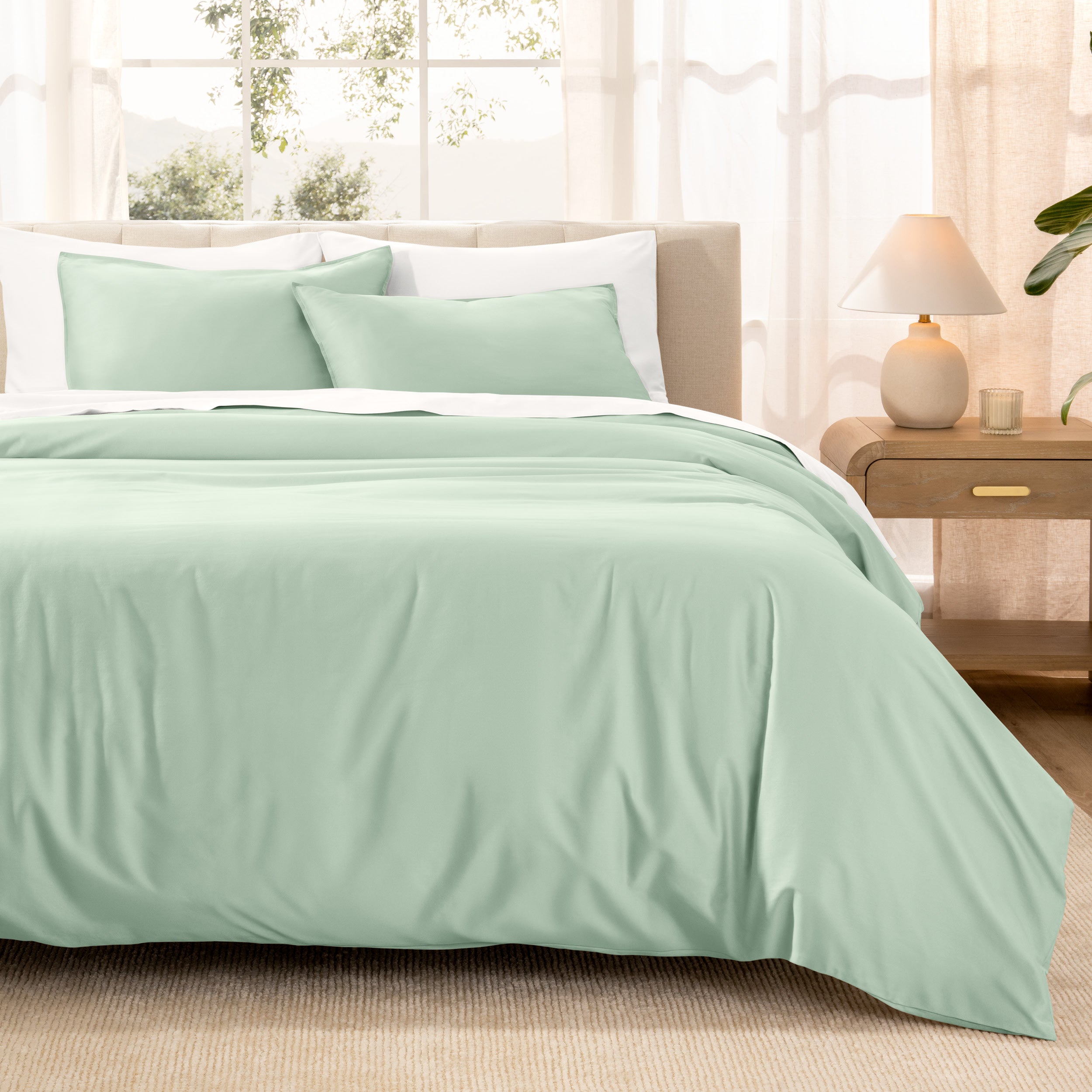 Warm bright room scene showing Sateen Duvet Set  laid out over the bed