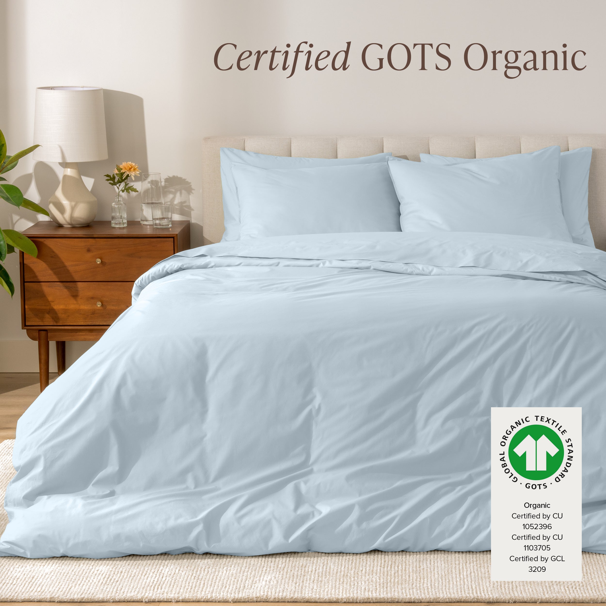 A modern bed with a organic cotton percale duvet cover on, it's Certified GOTS Organic.