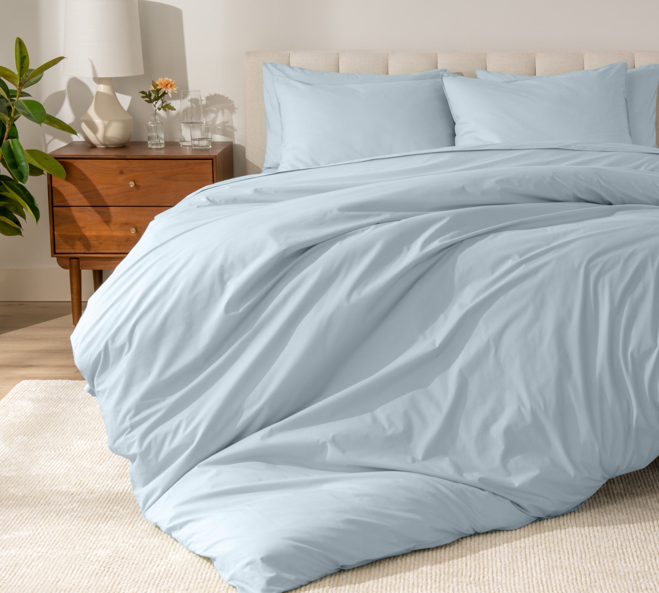 A modern bed with a organic cotton percale duvet cover on.