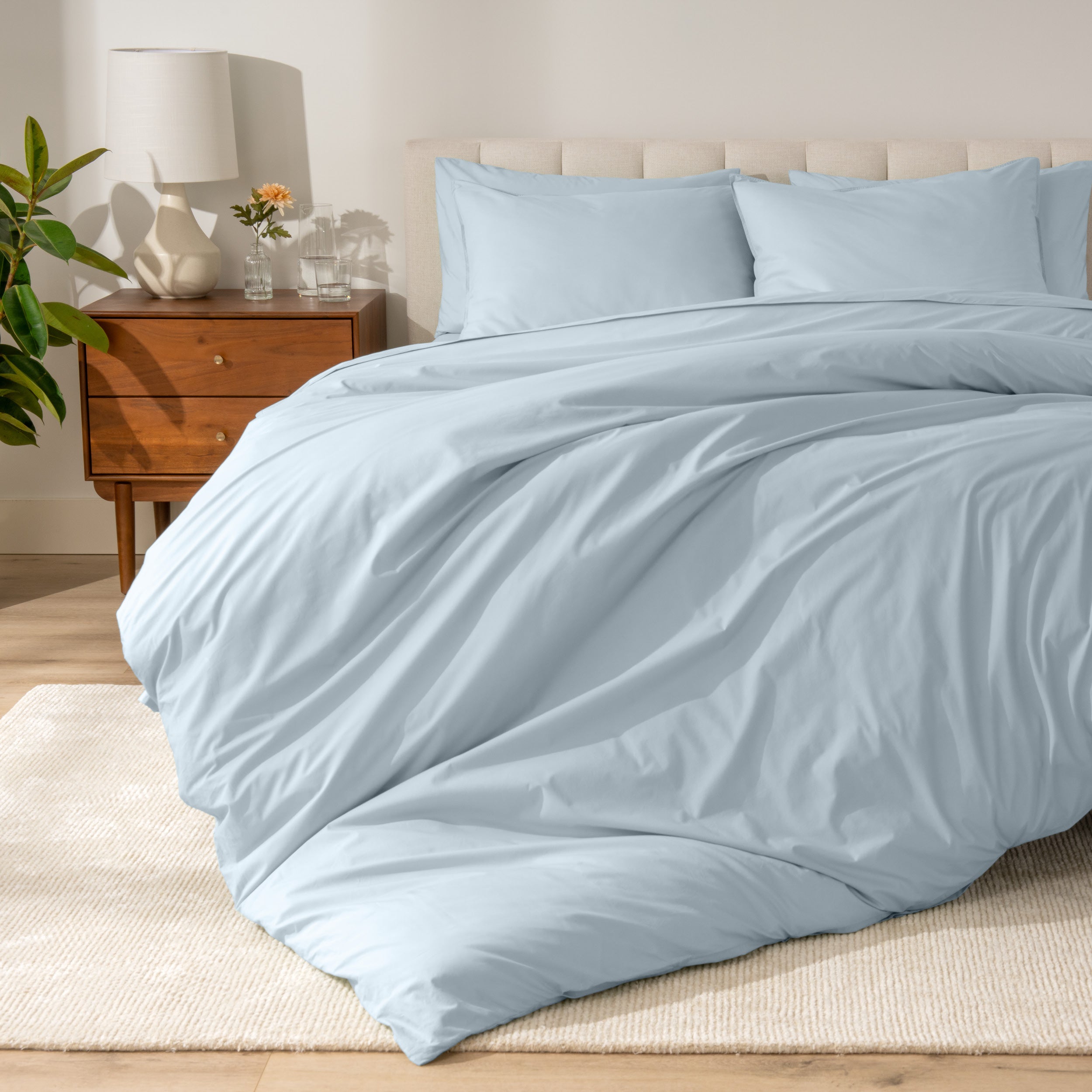 A modern bed with a organic cotton percale duvet cover on.