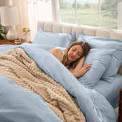 A women sleep on the bed with organic cotton percale duvet cover and pillowcases.